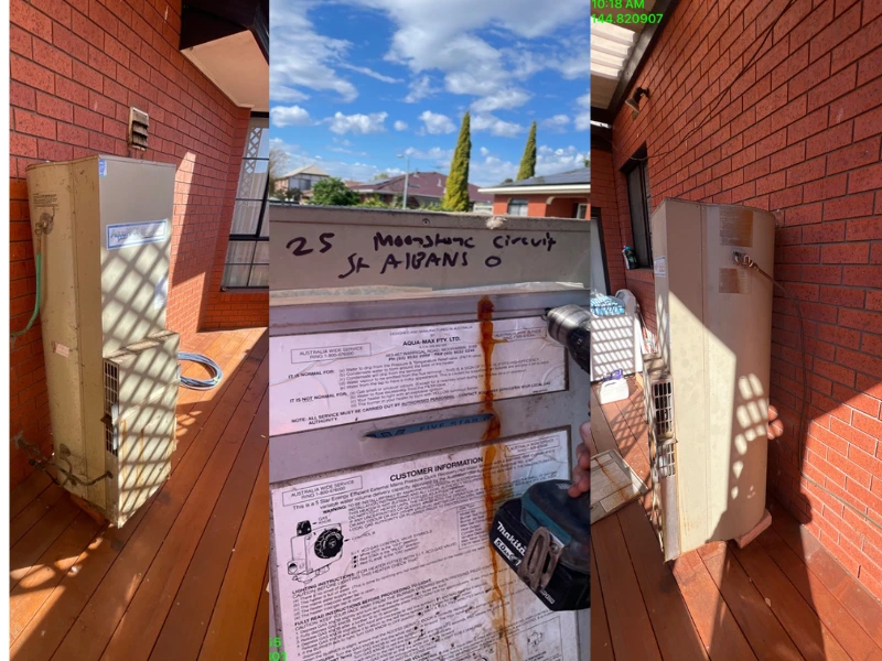 Old Aquamax gas hot water system being removed from outdoor deck at 25 Moonstone Circuit, St Albans