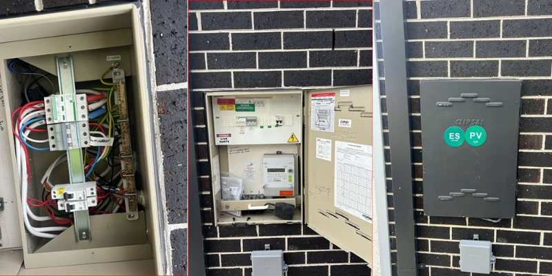 Closed Clipsal switchboard on brick wall with green ES emergency stop and PV solar isolation labels